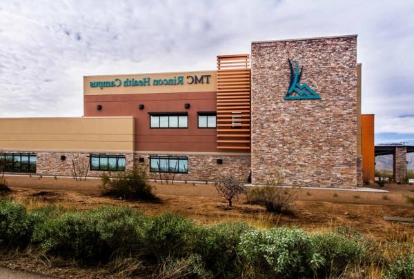 Exterior photo of TMC Rincon Health Campus in the desert. Natural earth tones were used on the exterior finishes